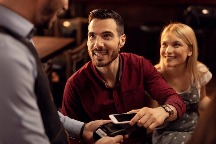 Antarmuka aplikasi vivalavida88 menampilkan meja live-dealer blackjack dengan dealer dan pemain lain di layar mobile.